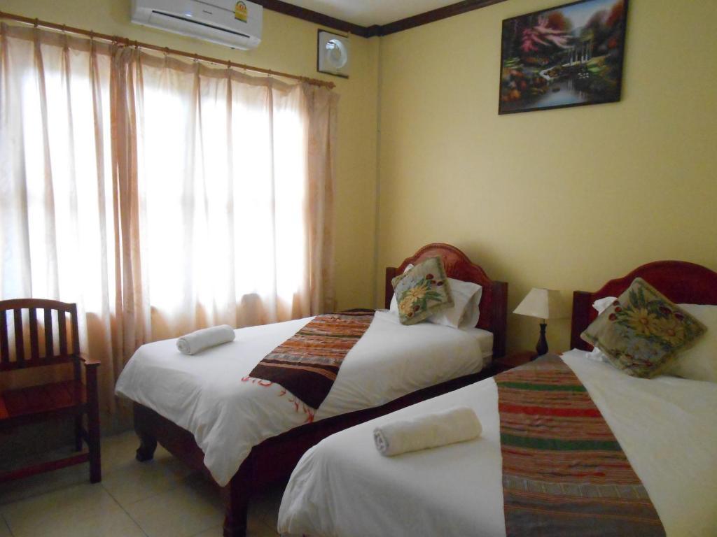 Khampaseuth Hotel Vang Vieng Quarto foto